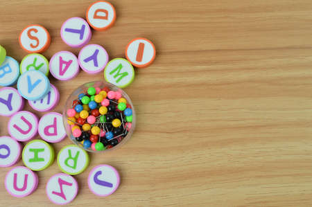Top view of alphabet letters and pinboards on wooden table with copy spaceの写真素材