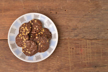 Chocolate brownie cookies on white plate. Malay traditional cookies served during Eid Fitri.