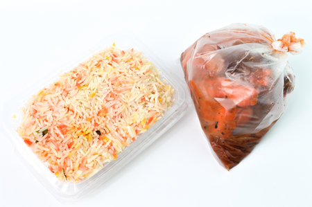 Mandy chicken rice set with spicy chicken over white background. The Mandy chicken rice is pretty flavoursome with the spices, aromatics and chicken dripping.の写真素材