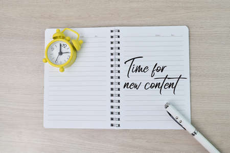 Phrase TIME FOR NEW CONTENT written on notebook. Conceptual imageの写真素材