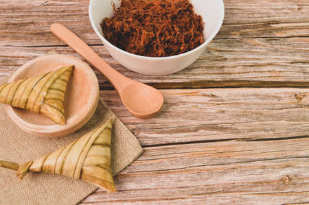 Malay traditional food called as Ketupat rice or Ketupat Palas. Glutinous rice is wrapped with...