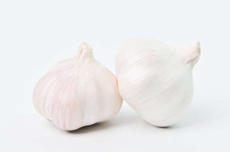 Fresh garlic isolated on a white background. Garlic is a species in the onion genus, Allium.の写真素材