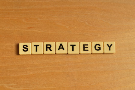 Alphabet letters with text STRATEGY on wooden backgroundの写真素材