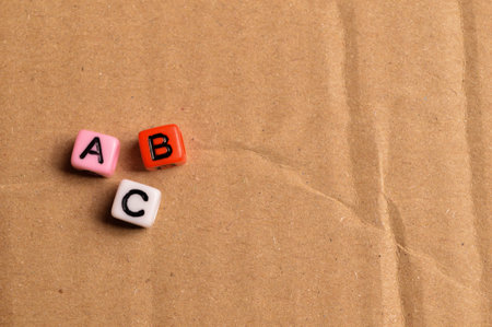 Top view of colorful alphabet beads with text ABC.の写真素材
