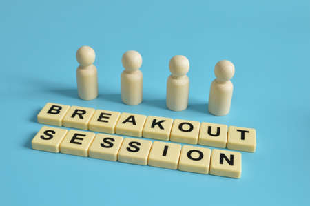 Wooden figures of people and alphabet letters with text BREAKOUT SESSION. Business concept.の写真素材