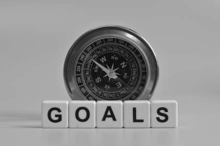 Magnetic compass and alphabet letters with text GOALS.の写真素材
