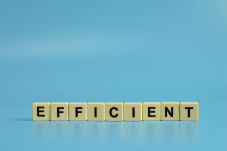Alphabet letters with text EFFICIENT on blue backgroundの写真素材