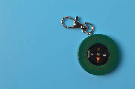 Magnetic qibla compass isolated on blue backgroundの写真素材