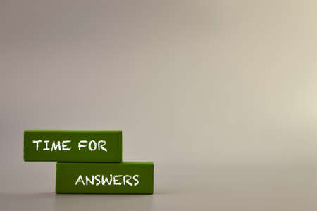Wooden blocks written with text TIME FOR ANSWERS.