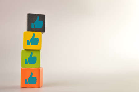 Wooden blocks with like symbols. Customer evaluation and satisfaction concept.の写真素材