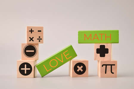Wooden blocks with text LOVE MATH and math symbolsの写真素材
