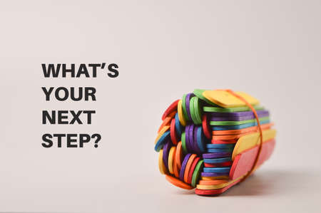 Colorful ice cream sticks with text WHAT'S YOUR NEXT STEP?の写真素材
