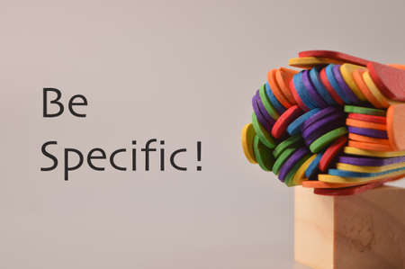 Colorful ice cream sticks with text BE SPECIFIC!