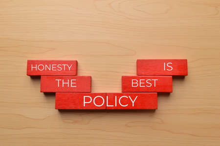 Wooden blocks written with HONESTY IS THE BEST POLICYの写真素材