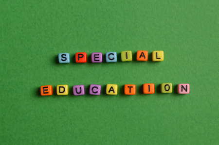 Alphabet letters with text SPECIAL EDUCATION isolated on green backgroundの写真素材