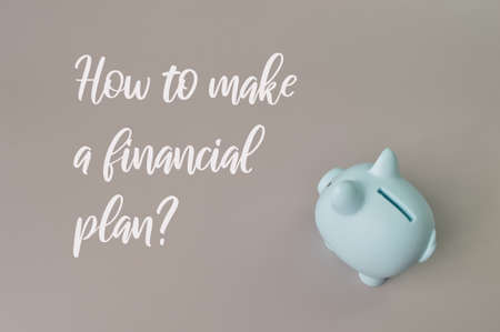 Piggy bank isolated on grey background with text HOW TO MAKE A FINANCIAL PLAN?
