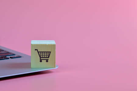 Wooden block with shopping cart symbol. Online shopping, Electronic Commerce or E-Commerce conceptの写真素材