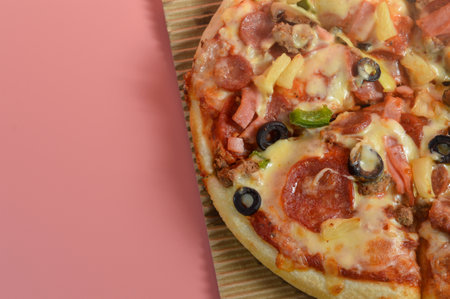 Super Supreme Mozzarella Cheese Pizza isolated on pink backgroundの写真素材