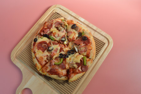 Super Supreme Mozzarella Cheese Pizza isolated on pink backgroundの写真素材
