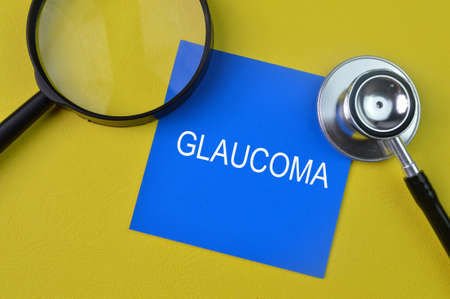 Stethoscope and blue note with text GLAUCOMAの写真素材