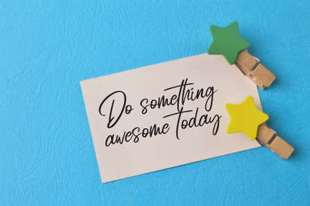 White paper with phrase DO SOMETHING AWESOME TODAYの写真素材