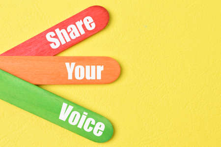 Colorful ice cream sticks with phrase SHARE YOUR VOICEの写真素材