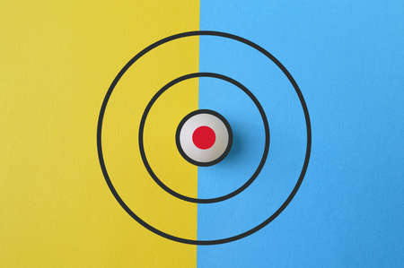 Target icon drawn on yellow and blue backgroundの写真素材
