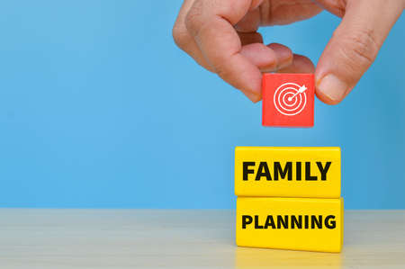 Family planning goals concept. Yellow wooden blocks with text FAMILY PLANNINGの写真素材