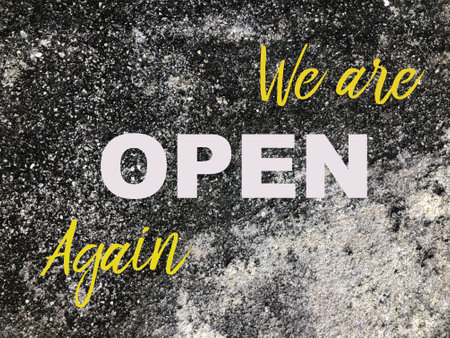 Cement texture grunge background written with text WE ARE OPEN AGAINの写真素材