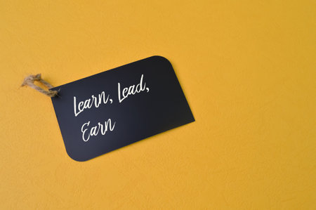 Label tag written with text LEARN, LEAD and EARN.の写真素材