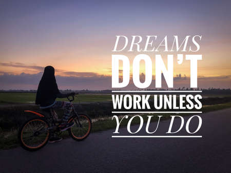 Motivational and inspirational quote written with phrase DREAMS DON'T WORK UNLESS YOU DOの写真素材
