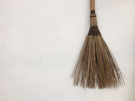 Broom made of twigs isolated on a white background
