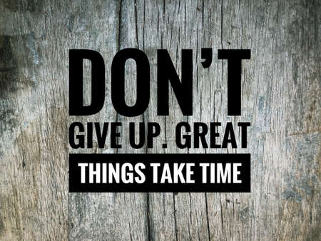 Motivational quote written with phrase DON'T GIVE UP, GREAT THINGS TAKE TIMEの写真素材