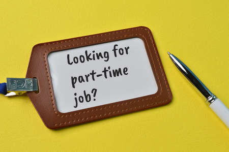 Pen and name tag written with question LOOKING FOR PART-TIME JOB?