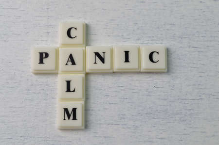 Square letters with text CALM and PANICの写真素材