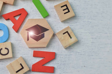 Alphabet letters with graduation cap symbol. Education concept.