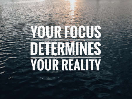 Motivational and inspirational quote with phrase YOUR FOCUS DETERMINES YOUR REALITY