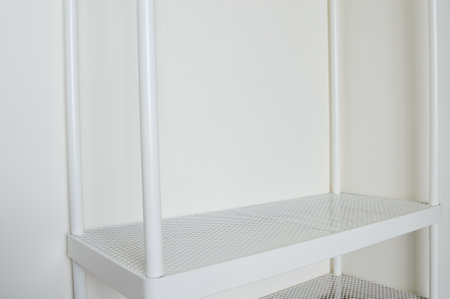 An empty white wardrobe in bright interior