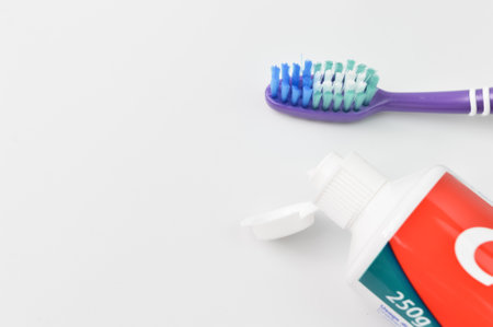 Toothbrush and toothpaste isolated on a white background