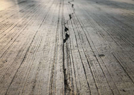 Cracks on the damaged cement floor with copy spaceの写真素材