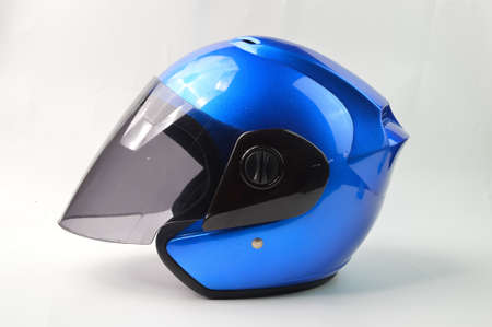 Blue motorcycle helmet isolated on a white backgroundの写真素材