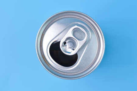 Close up view of aluminum drink can isolated on a blue background