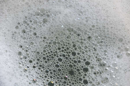 Close up view of liquid soap foam texture background