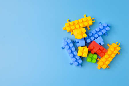Plastic building blocks isolated on a blue backgroundの写真素材