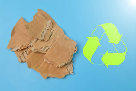 Torn cardboard with recycle symbol. Eco and save the earth concept