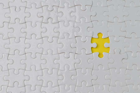 Incomplete white jigsaw puzzle pieces. Flat lay view.