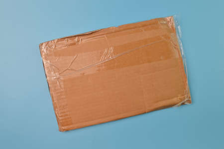 An empty cardboard isolated on a blue background