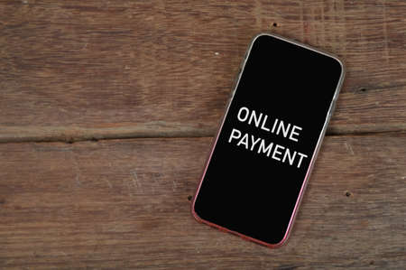 Black smartphone written with phrase ONLINE PAYMENT