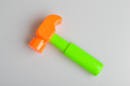 Toy claw hammer isolated on a grey background
