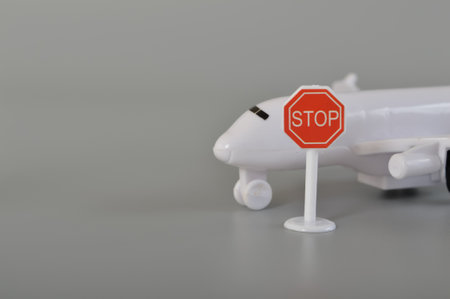 Airplane with stop sign symbol. Concept of ban flying, travel ban, forbidden sign and flight ban...